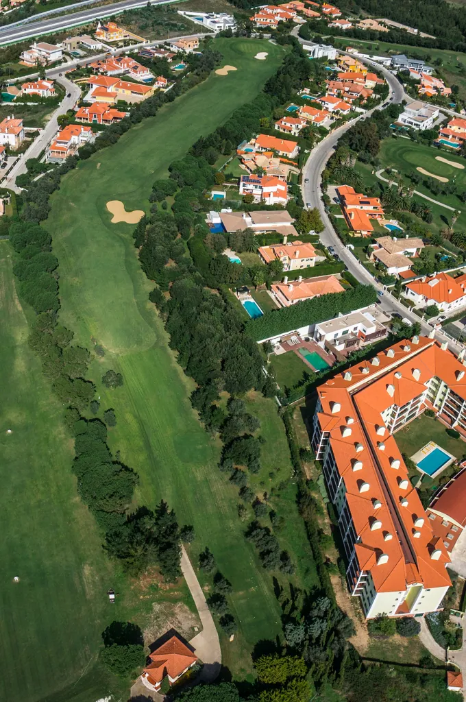 Hole 10 of Pestana Beloura Golf from the air, with Beloura’s homes around it