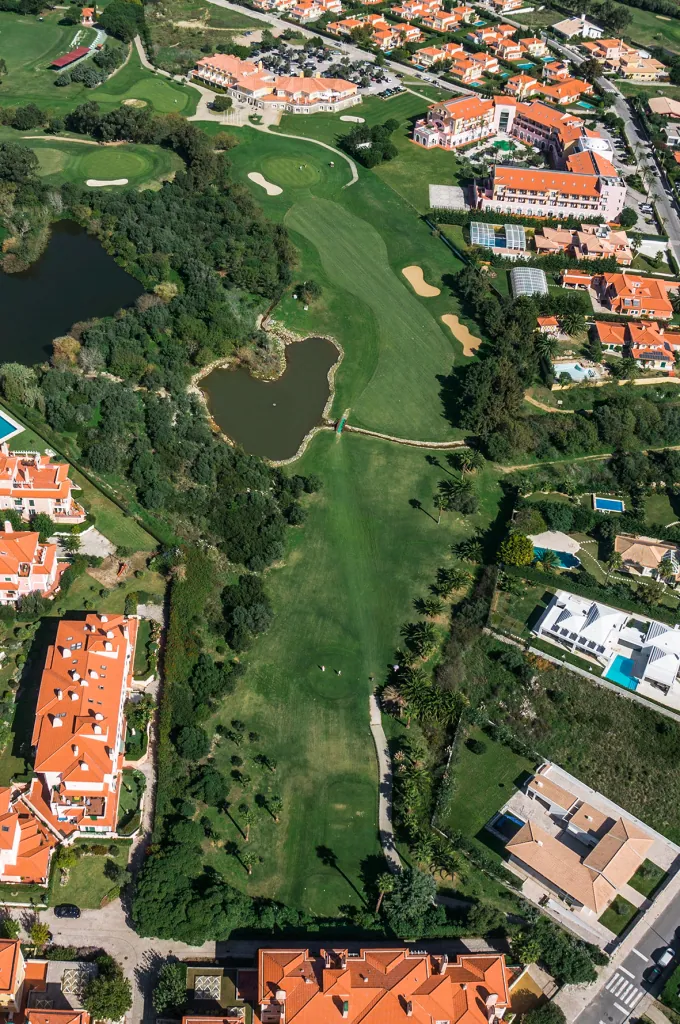 Hole 18 of Pestana Beloura Golf from the air, with Beloura’s homes around it