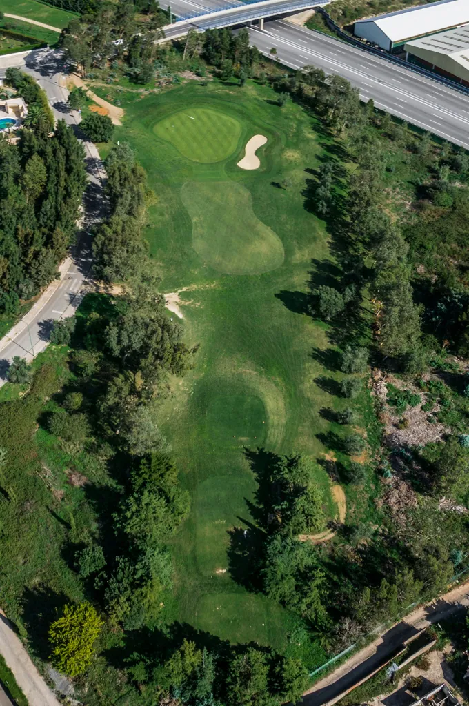 Hole 5 of Pestana Beloura Golf from the air, with Beloura’s homes around it