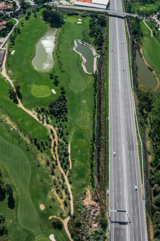 Hole 7 of Pestana Beloura Golf from the air, with Beloura’s homes around it