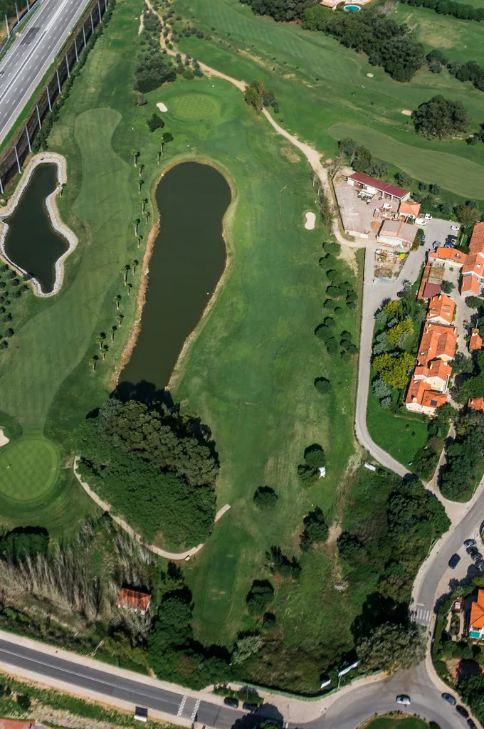 Hole 8 of Pestana Beloura Golf from the air, with Beloura’s homes around it