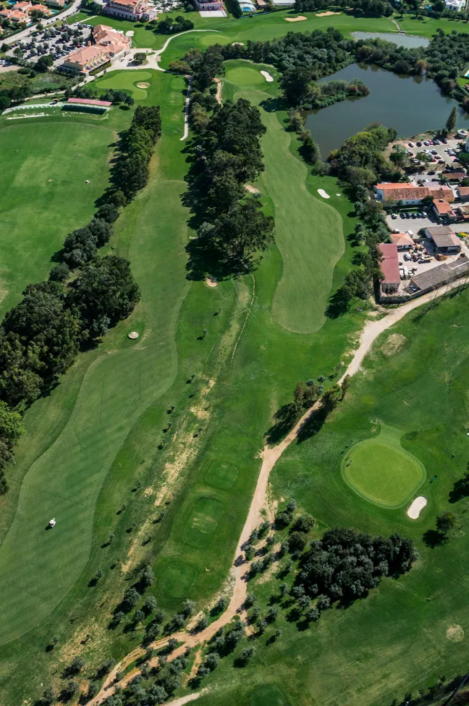 Hole 9 of Pestana Beloura Golf from the air, with Beloura’s homes around it