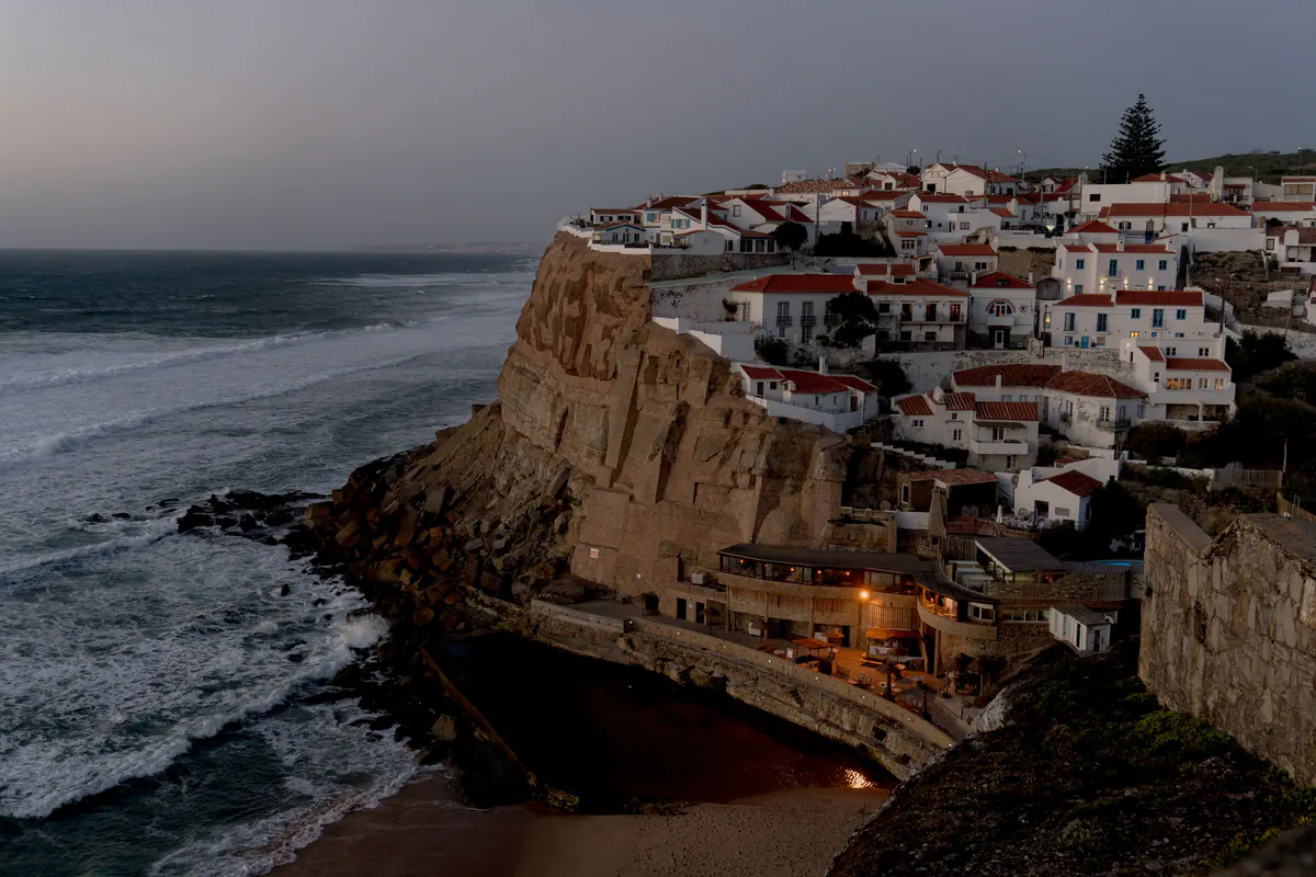 Azenhas do Mar at dusk, the first lights on in the cliff-top houses